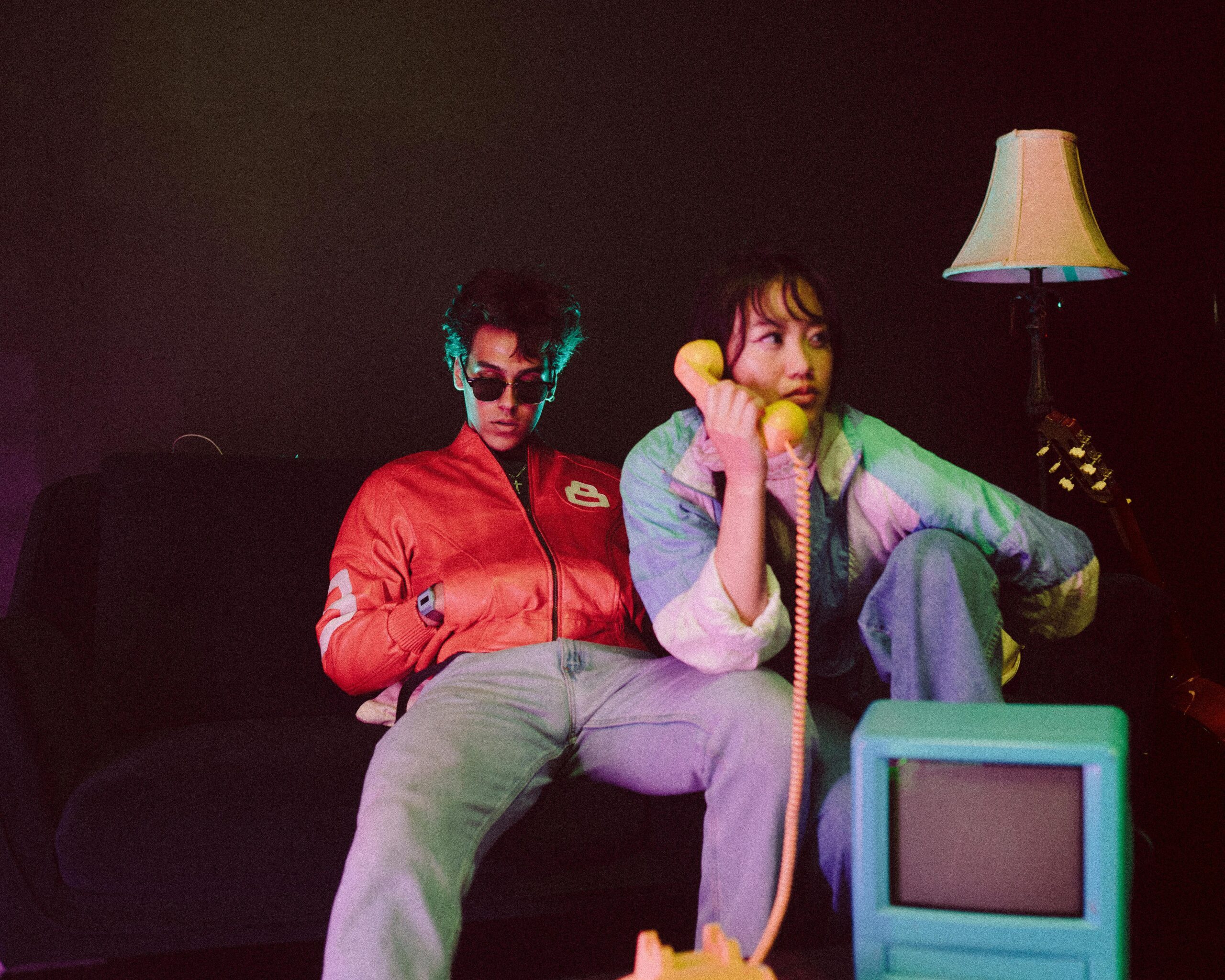 A stylish couple in a retro setting with vintage decor, exuding a nostalgic vibe.